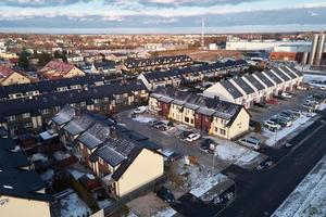 Aerial drone view of residential neighborhood in winter season photo