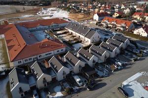 Aerial drone view of residential neighborhood in winter season photo