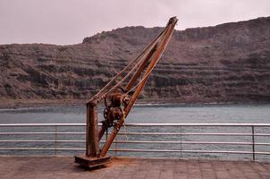 Industrial metal winch on the coast photo