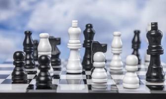 A game of chess with passing clouds behind photo