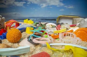 A beautiful beach covered with rubbish and trash photo