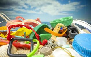 A beautiful beach covered with rubbish and trash photo