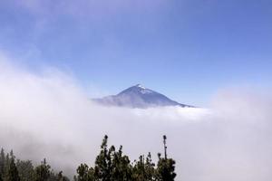 El teide volcano in the clouds in tenerife spain photo