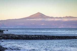 El teide volcano viewed from beach in tenerife spain photo