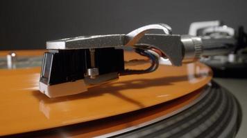 Close up vinyl record playing on record player photo
