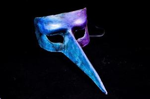 Mask on dark background photo