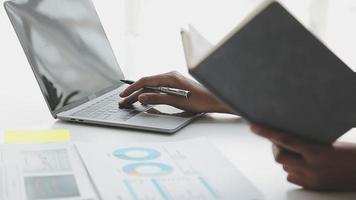 Financial analysts analyze business financial reports on a digital tablet planning investment project during a discussion at a meeting of corporate showing the results of their successful teamwork. video