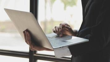 Financial analysts analyze business financial reports on a digital tablet planning investment project during a discussion at a meeting of corporate showing the results of their successful teamwork. video