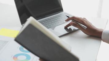 Financial analysts analyze business financial reports on a digital tablet planning investment project during a discussion at a meeting of corporate showing the results of their successful teamwork. video