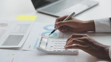 Financial analysts analyze business financial reports on a digital tablet planning investment project during a discussion at a meeting of corporate showing the results of their successful teamwork. video