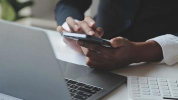 Financial analysts analyze business financial reports on a digital tablet planning investment project during a discussion at a meeting of corporate showing the results of their successful teamwork. video