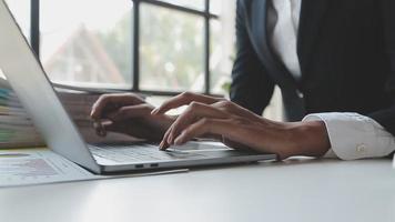 Financial analysts analyze business financial reports on a digital tablet planning investment project during a discussion at a meeting of corporate showing the results of their successful teamwork. video