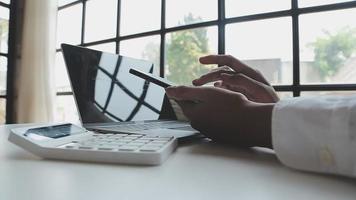 Financial analysts analyze business financial reports on a digital tablet planning investment project during a discussion at a meeting of corporate showing the results of their successful teamwork. video