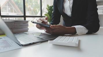 Financial analysts analyze business financial reports on a digital tablet planning investment project during a discussion at a meeting of corporate showing the results of their successful teamwork. video