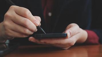 Business partnership coworkers using a tablet to chart company financial statements report and profits work progress and planning in office room. video