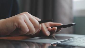 Business partnership coworkers using a tablet to chart company financial statements report and profits work progress and planning in office room. video