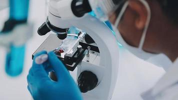 Medical Science LaboratoryPortrait of Beautiful Black Scientist Looking Under Microscope Does Analysis of Test Sample. Ambitious Young Biotechnology Specialist, working with Advanced Equipment video