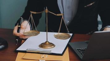 Male lawyer working with contract papers and wooden gavel on tabel in courtroom. justice and law ,attorney, court judge, concept.. video