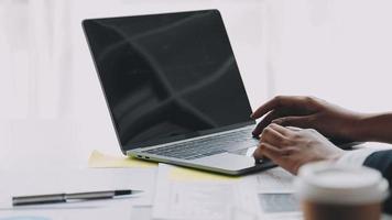 Financial analysts analyze business financial reports on a digital tablet planning investment project during a discussion at a meeting of corporate showing the results of their successful teamwork. video