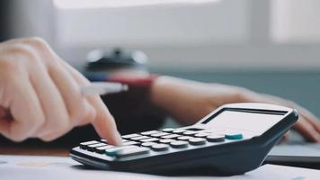 Financial analysts analyze business financial reports on a digital tablet planning investment project during a discussion at a meeting of corporate showing the results of their successful teamwork. video