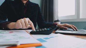Financial analysts analyze business financial reports on a digital tablet planning investment project during a discussion at a meeting of corporate showing the results of their successful teamwork. video