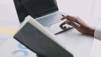 Financial analysts analyze business financial reports on a digital tablet planning investment project during a discussion at a meeting of corporate showing the results of their successful teamwork. video