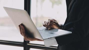 Financial analysts analyze business financial reports on a digital tablet planning investment project during a discussion at a meeting of corporate showing the results of their successful teamwork. video