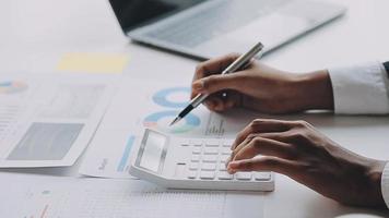 Financial analysts analyze business financial reports on a digital tablet planning investment project during a discussion at a meeting of corporate showing the results of their successful teamwork. video