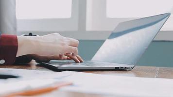 Financial analysts analyze business financial reports on a digital tablet planning investment project during a discussion at a meeting of corporate showing the results of their successful teamwork. video