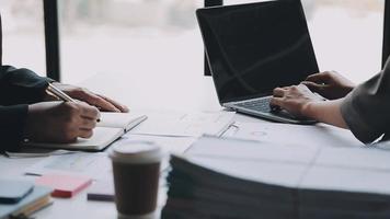 Financial analysts analyze business financial reports on a digital tablet planning investment project during a discussion at a meeting of corporate showing the results of their successful teamwork. video