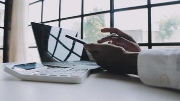 Financial analysts analyze business financial reports on a digital tablet planning investment project during a discussion at a meeting of corporate showing the results of their successful teamwork. video