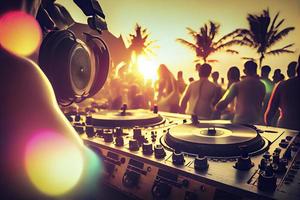 Dj mixing outdoor at beach party festival with crowd of people in background - Summer nightlife photo