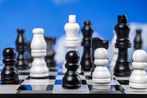 A game of chess with passing clouds behind photo