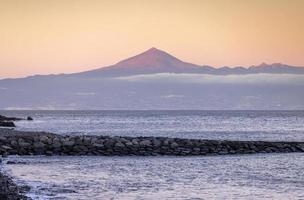 El teide volcano viewed from beach in tenerife spain photo