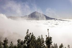 El teide volcano above the clouds in tenerife spain photo