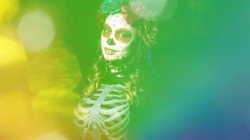 Beautiful woman with custom designed candy skull mexican day of the dead face make up video