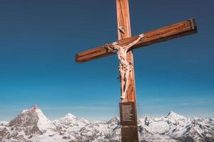 Panoramic view of the Swiss Alps mountains from the terrace of the Matterhorn glacier paradise, Switzerland. The Cross at Matterhorn glacier paradise - Klein Matterhorn. photo