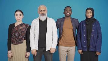 Portrait of multiethnic people. Different race and ethnicity concept. Candid portrait of asian woman, indian man and african man and woman. Interracial people looking at camera. video