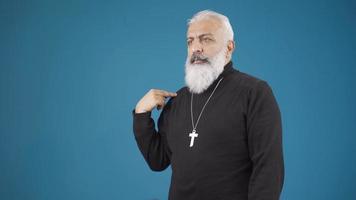 Christian mature man making the sign of the cross, it means he has faith in Jesus Christ. The Christian makes the sign of the cross, which means he believes in Jesus. video