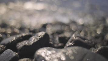 A volcanic rock beach with extreme bokeh and nice out of focus areas video