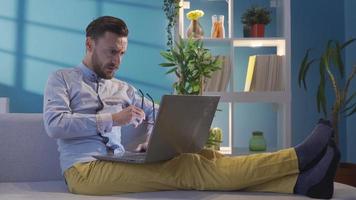 Shocked man working from laptop at home frustrated. Elegant and stylish man gets angry. Charismatic Blonde Haired Handsome Adult Man Using Laptop, Worried and Frustrated. video