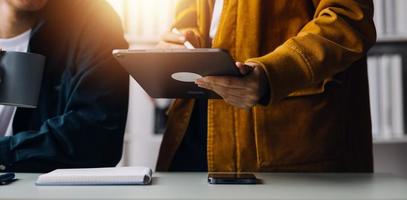 Close up ux developer and ui designer use augmented reality brainstorming about mobile app interface wireframe design on desk at modern office.Creative digital development agency photo