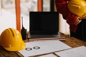 Construction and structure concept of engineer working drawing on blueprint meeting for project working with partner on model building and engineering tools in working site, construction concept photo