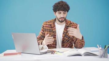 A university student who is bored with studying is getting bored and dropping his head. A young college student who is in exam week or doing homework. video