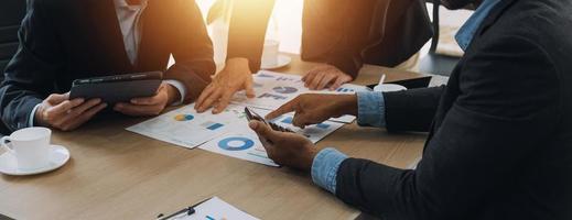 Entrepreneurs and business people conference in modern meeting room, happy multiracial coworkers have fun cooperating working together at office meeting, asian teamwork concept photo