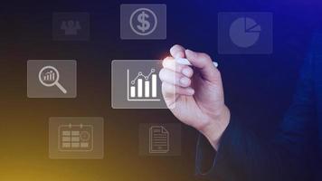 Big data analytics and business intelligence BI concept with chart and graph icons on digital screen interface and business people in the background. photo