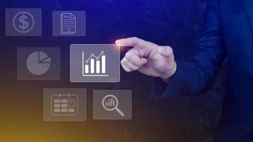 Big data analytics and business intelligence BI concept with chart and graph icons on digital screen interface and business people in the background. photo