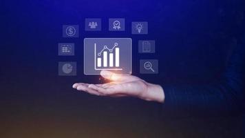Big data analytics and business intelligence BI concept with chart and graph icons on digital screen interface and business people in the background. photo