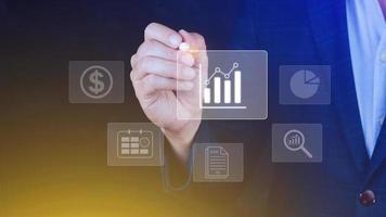 Big data analytics and business intelligence BI concept with chart and graph icons on digital screen interface and business people in the background. photo