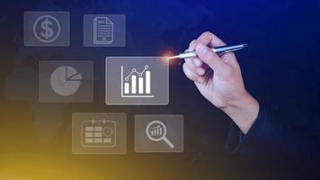 Big data analytics and business intelligence BI concept with chart and graph icons on digital screen interface and business people in the background. photo